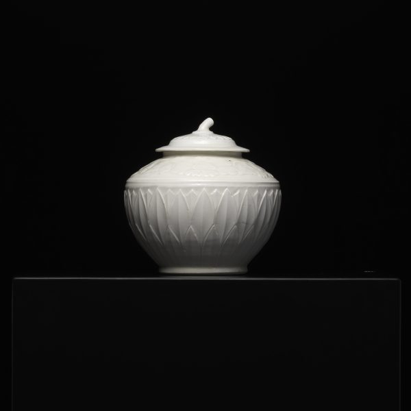 A White-glazed DING Pot with Bas-relief of Lotus Petals and Peony Flowers(Seal Mark: Guan)
