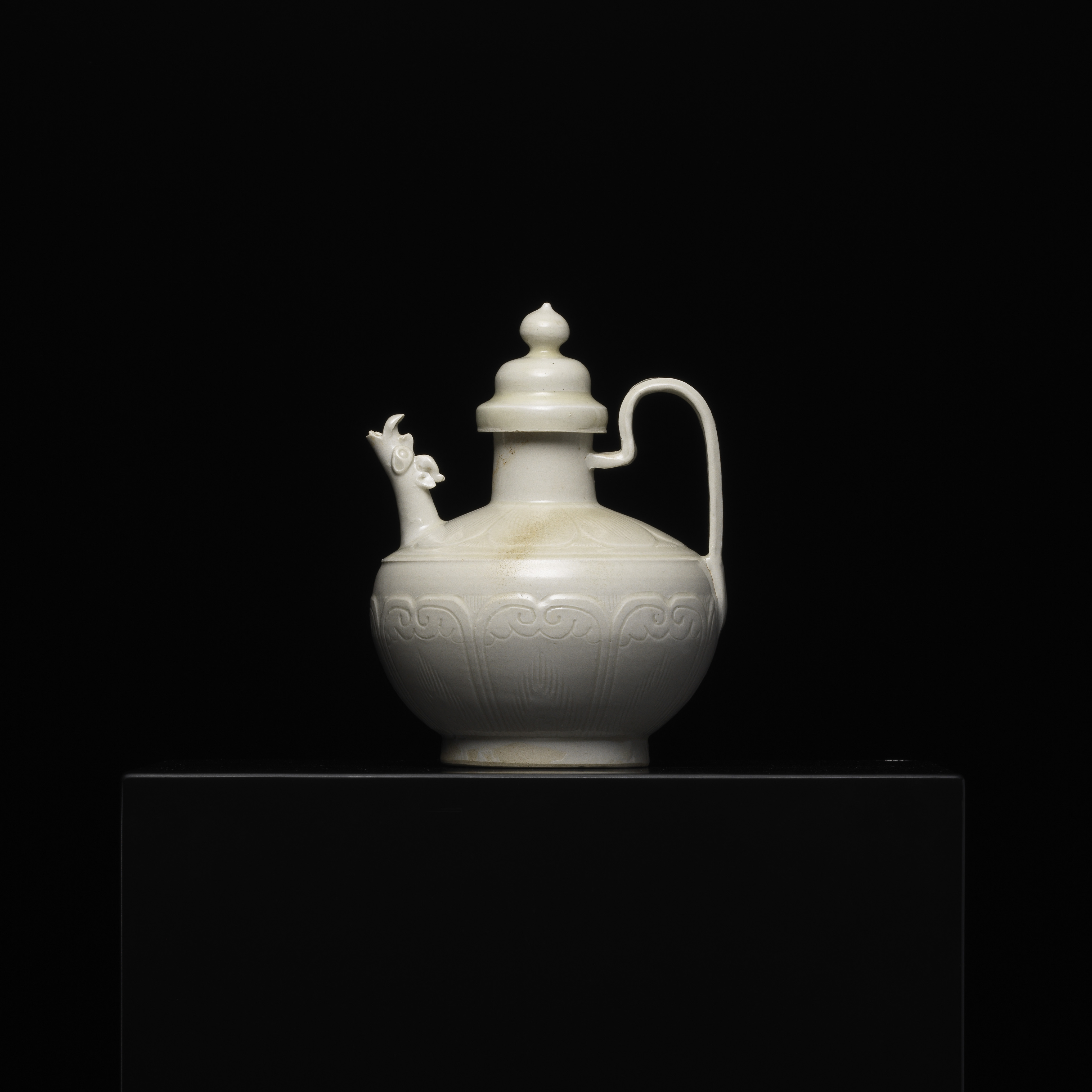 A White-glazed DING “Dragon” Ewer with Bas-relief of Lotus Petals